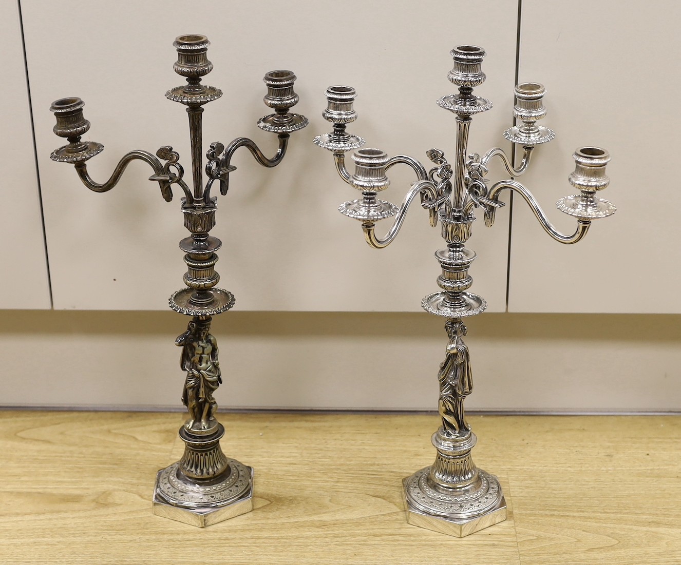 A pair of Elkington silver plated figural candelabra, 48.5 cms high